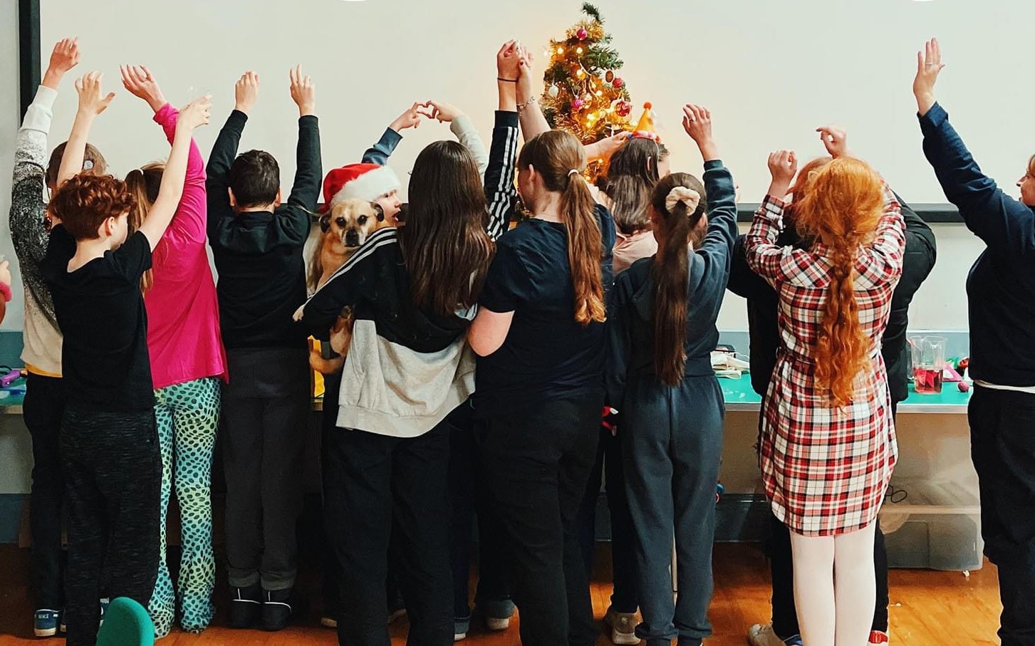 People around a christmas tree