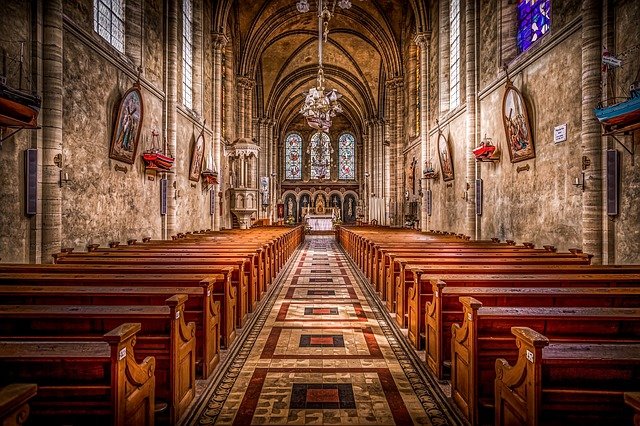 Inside a church building, facing the alter