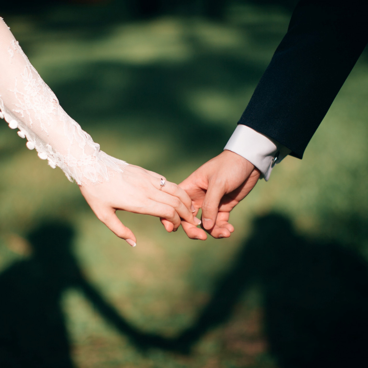 Wedding couple holding hands