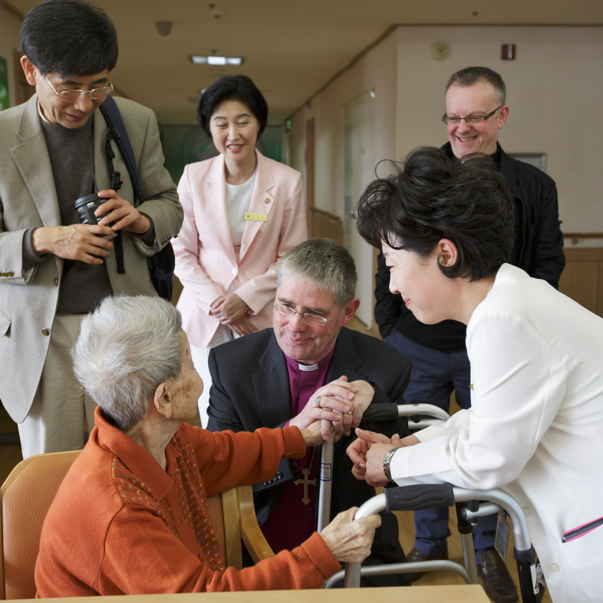 Bishop John talking to people in South Korea