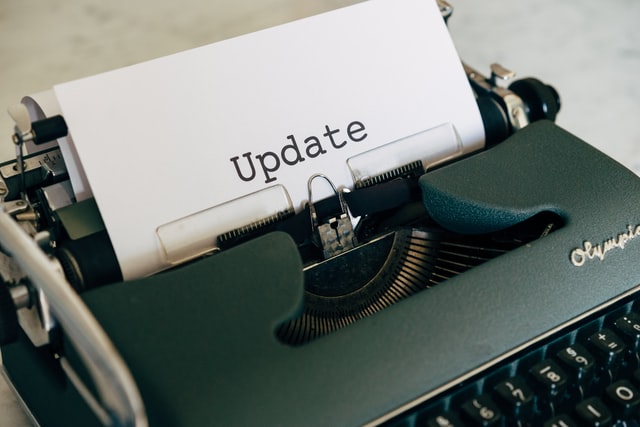 A typewriter typing the word 'update'