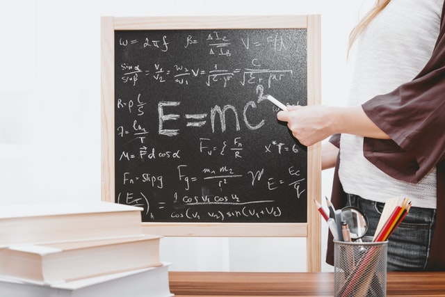 A blackboard with equations on