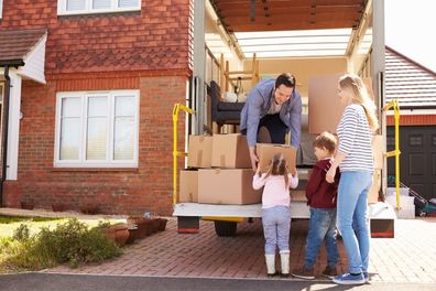 Family packing a moving van