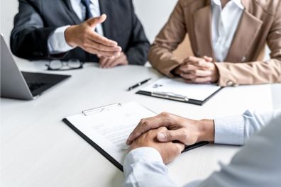 a committee sitting around a table